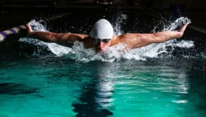 man swimming in swimming pool