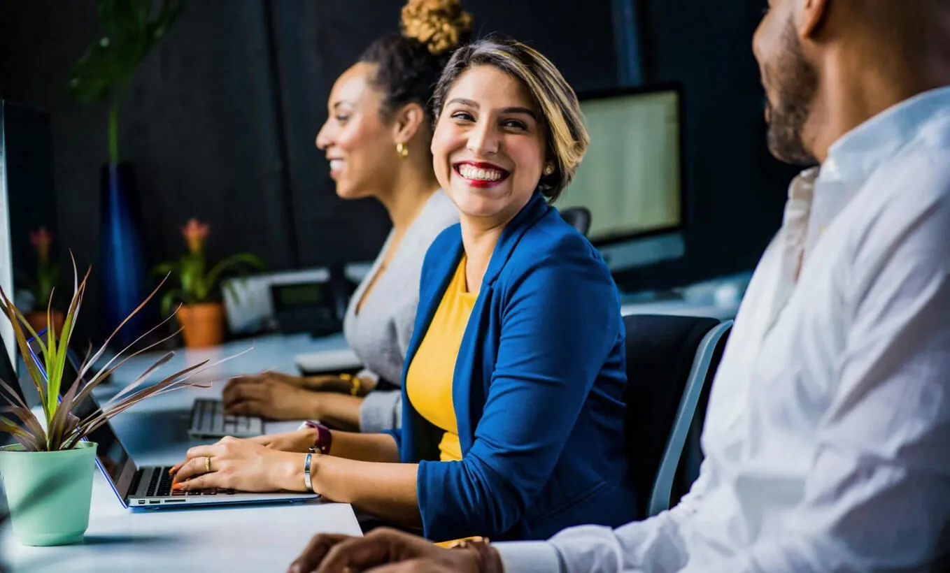 woman engaged in conversation with colleague