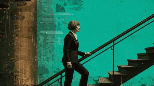 Businesswoman ascending a staircase.
